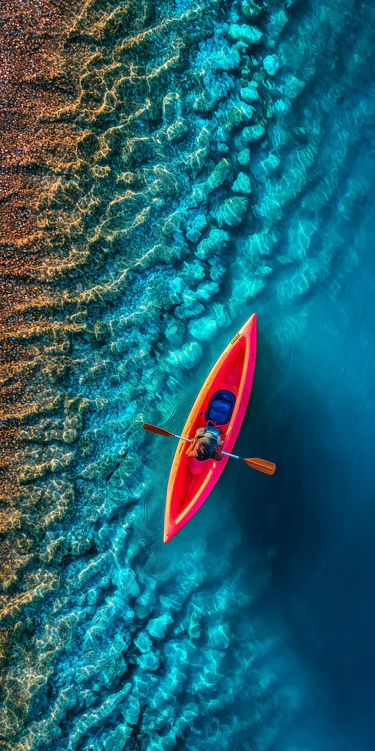 Phone wallpaper: Red kayak from above