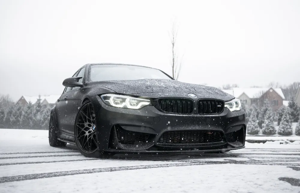 Обои Black BMW F80 on the Snow 640x1136