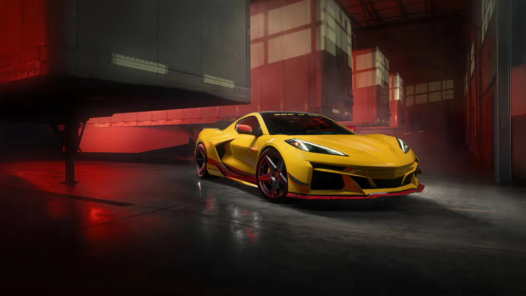 Обои на рабочий стол: Желтый Chevrolet Corvette Z06 в красном свете склада